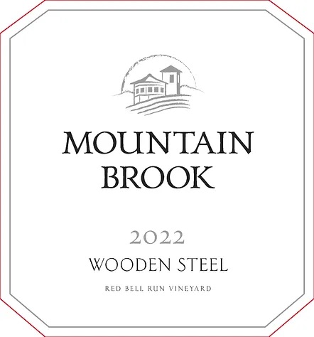 Wine label reads Mountain Brook 2022 Wooden Steel, Red Bell Run Vineyard with a house illustration above.