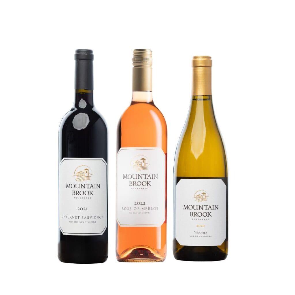 Three Mountain Brook wine bottles: Cabernet Sauvignon, Rosé of Merlot, and Viognier, standing side by side.